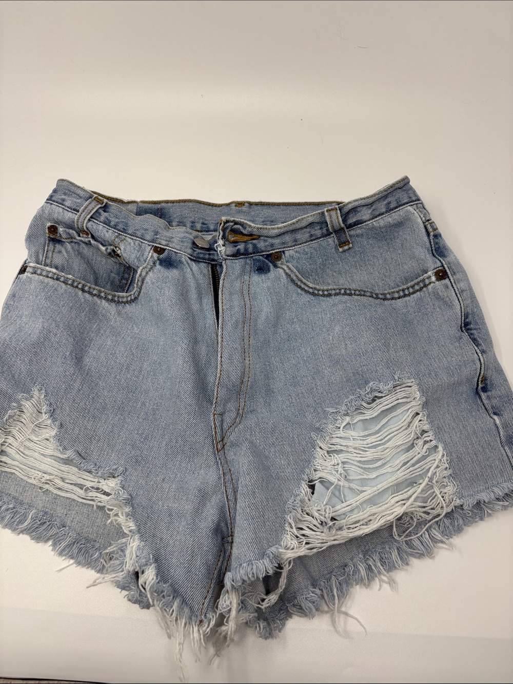 Levi’s High-Rise Light Blue Distressed Denim Shorts